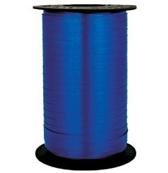 A roll of blue ribbon on top of a table.