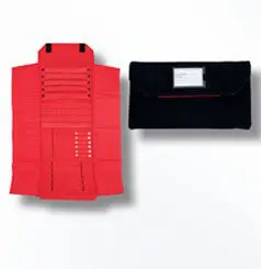 A red vest and black wallet are on display.