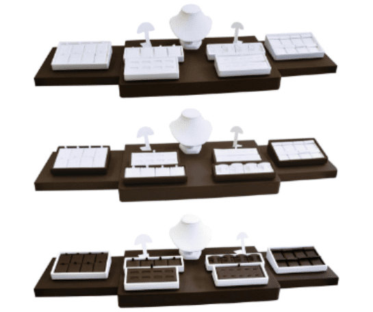 A set of three trays with different types of chocolates.