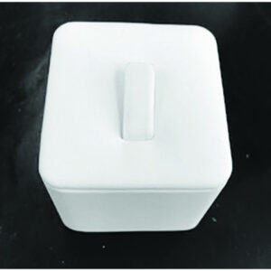 A white container sitting on top of a table.