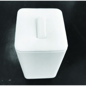 A white container sitting on top of a table.