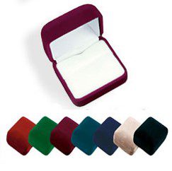 A red velvet ring box with several different colors of rings in it.