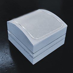 A white box with a silver trim on top of it.