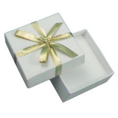 A white box with a gold bow on top of it.