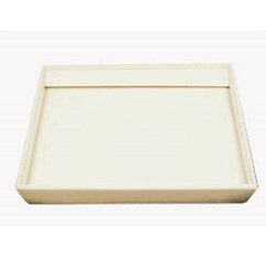 A white tray with a square lid on top.