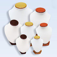 A group of white and brown jars with lids.