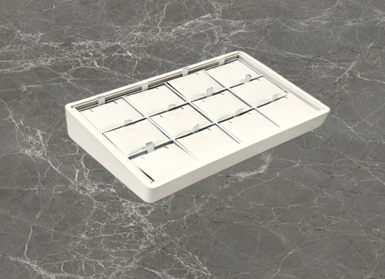 A white tray with 1 2 compartments on top of it.