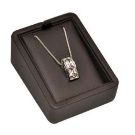 A necklace in a box on top of a table.