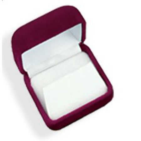 A red velvet box with a white card inside.