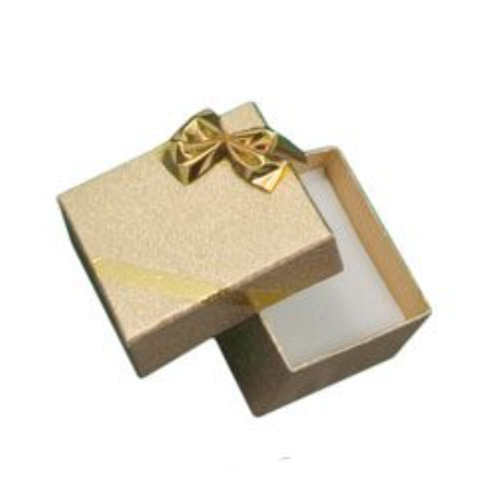 A gold box with a bow on top of it.