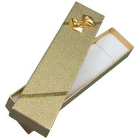 A gold box with a bow on top of it