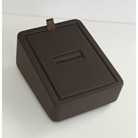 A brown box with a coin slot on top of it.