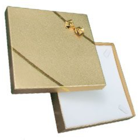 A gold box with a bow on top of it