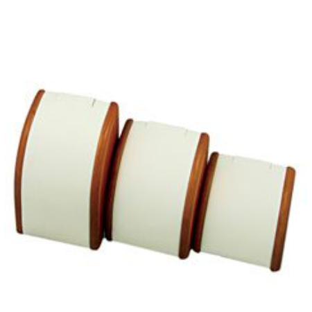 A set of three white and brown wooden cuffs.