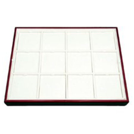 A white tile tray with red trim.