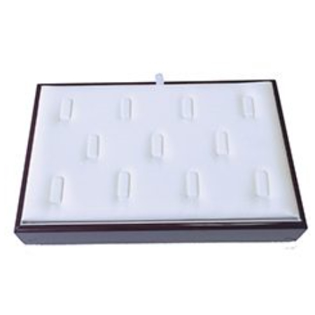 A white tray with 1 2 rings on top of it.