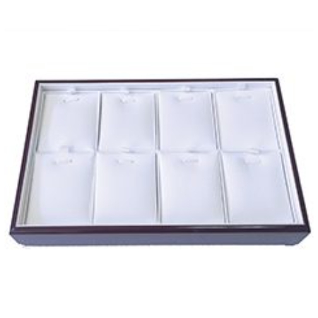 A tray with eight white jewelry trays in it.