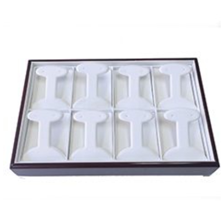 A tray of white plastic jewelry trays.