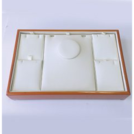 A white box with brown trim and four compartments.