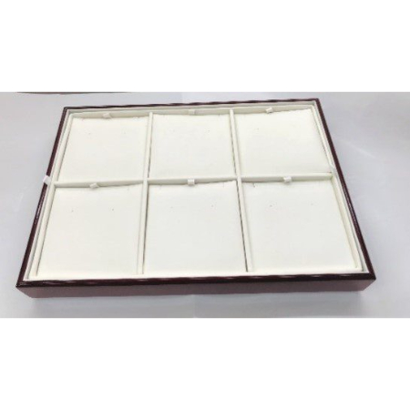 A brown tray with eight white cards in it.