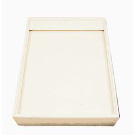 A white tray with a white lid on top of it.