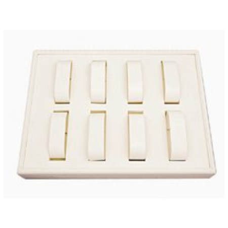 A white tray with eight rings in it.