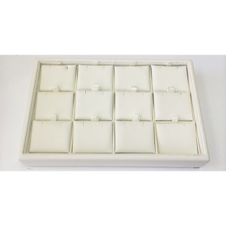 A white tray with 1 2 small trays in it.