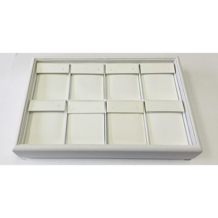 A white tray with ten compartments on top of it.