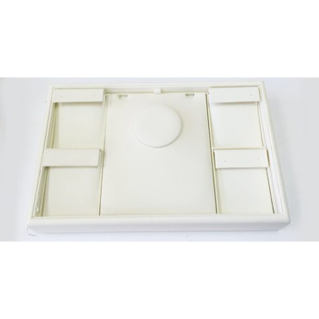 A white tray with four compartments on top.