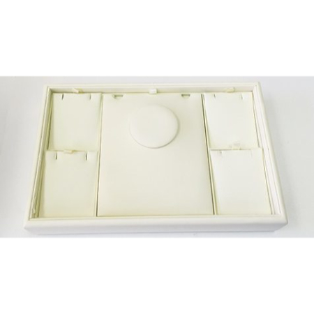 A white tray with several different sized compartments.