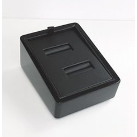 A black box with two small compartments on top.