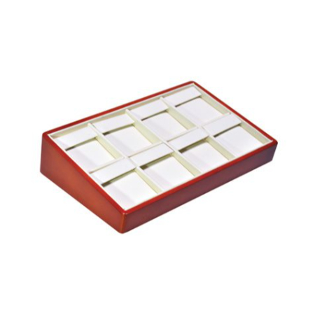 A red box with white compartments on top of it.