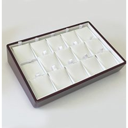 A brown tray with white trays in it