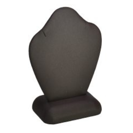 A black pillow sitting on top of a white table.