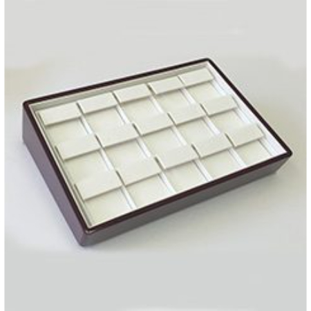 A brown tray with white trays in it