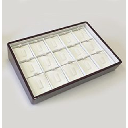 A brown tray with white trays in it