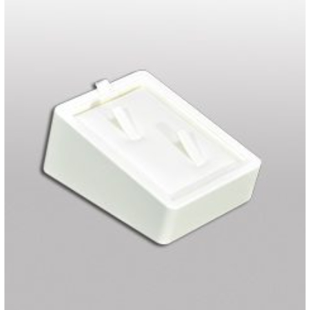 A white plastic box with two holes for jewelry.