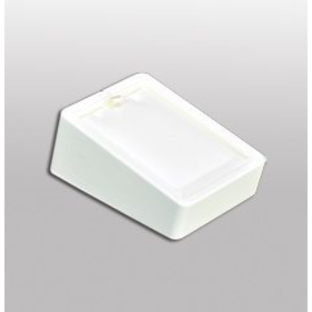 A white box with a yellow ribbon on top of it.