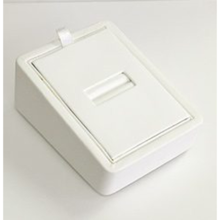 A white box with a slot for coins