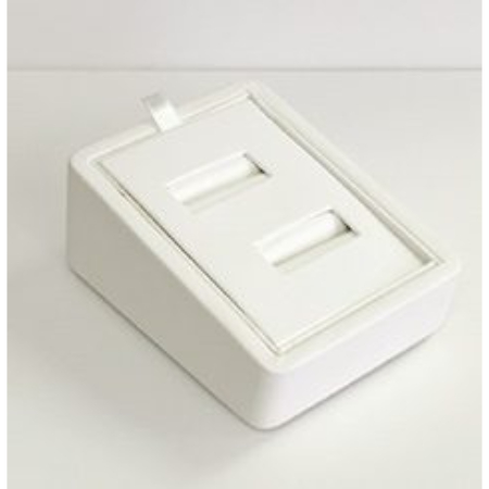 A white box with two compartments on top of it.