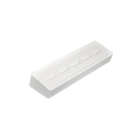 A white plastic object with four holes.