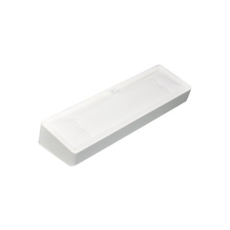 A white plastic object is sitting on top of the floor.