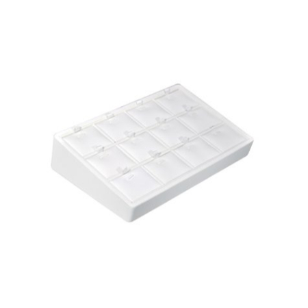 A white box with many compartments on top of it.