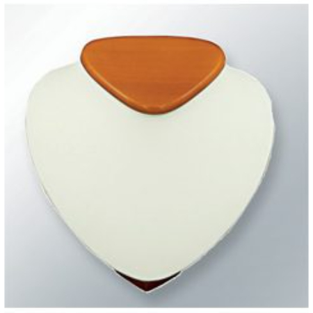 A white and orange heart shaped object on top of a wall.