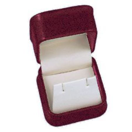 A red velvet jewelry box with a white earring.