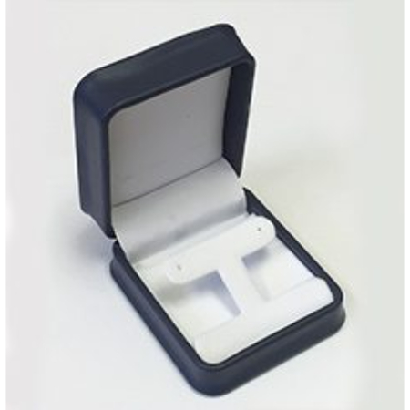 A black box with two white earrings in it.