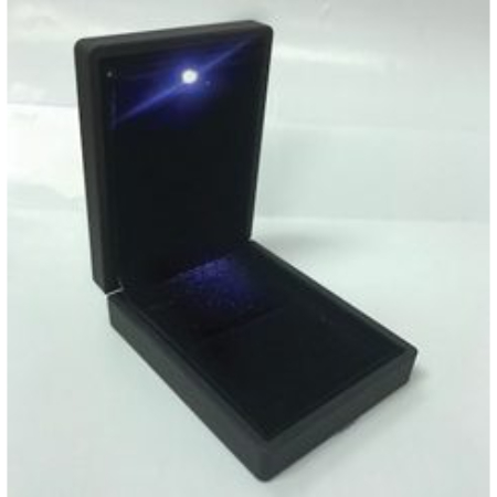 A black box with a light inside of it