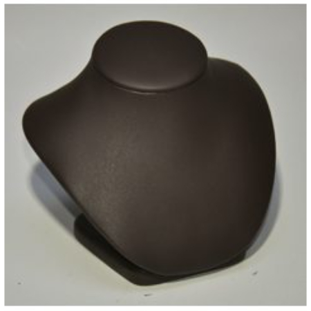 A brown leather necklace holder on top of a table.