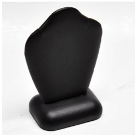 A black earring holder sitting on top of a table.