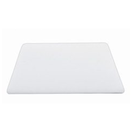 A white cutting board sitting on top of a table.